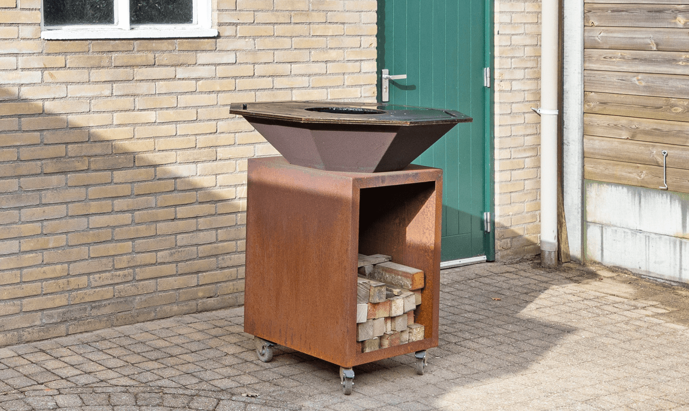 Maatwerk cortenstaal buitenhaard op wielen